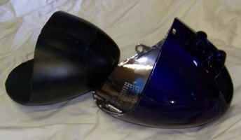 Headlight vibration dampener