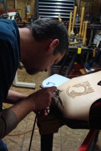 Chris of Three Mutts Custom airbrushing a custom design