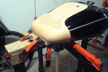 Forming a tank bib on a flanged tank