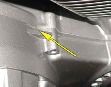 Use a wooden dowel to hit this tab and break the case loose