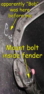 Left mount bolt inside fender