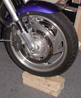 Front tire raised & blocked