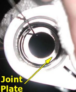 Fork spring joint plate being reinstalled