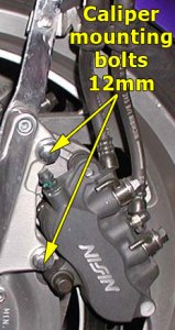 Left brake caliper mounting bolts